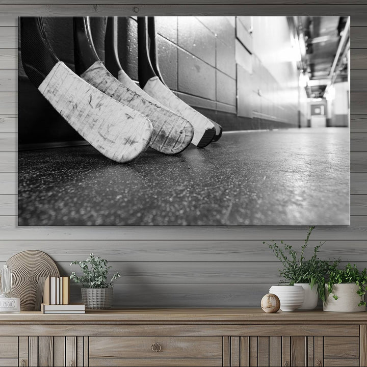 Ice Hockey Wall Art Canvas Print features a UV-protected black and white photo of hockey sticks.