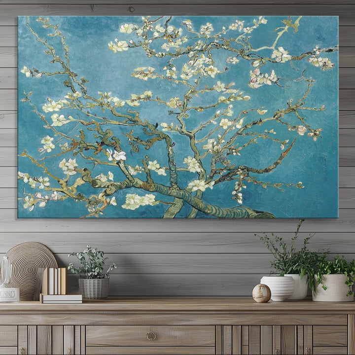 The wall art, Vincent Van Goghs Almond Blossom, stands out with its vibrant depiction against a serene blue background.