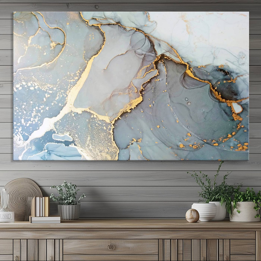 A blue and gold marbled Large Abstract Marble Wall Art Canvas Print hangs overhead.