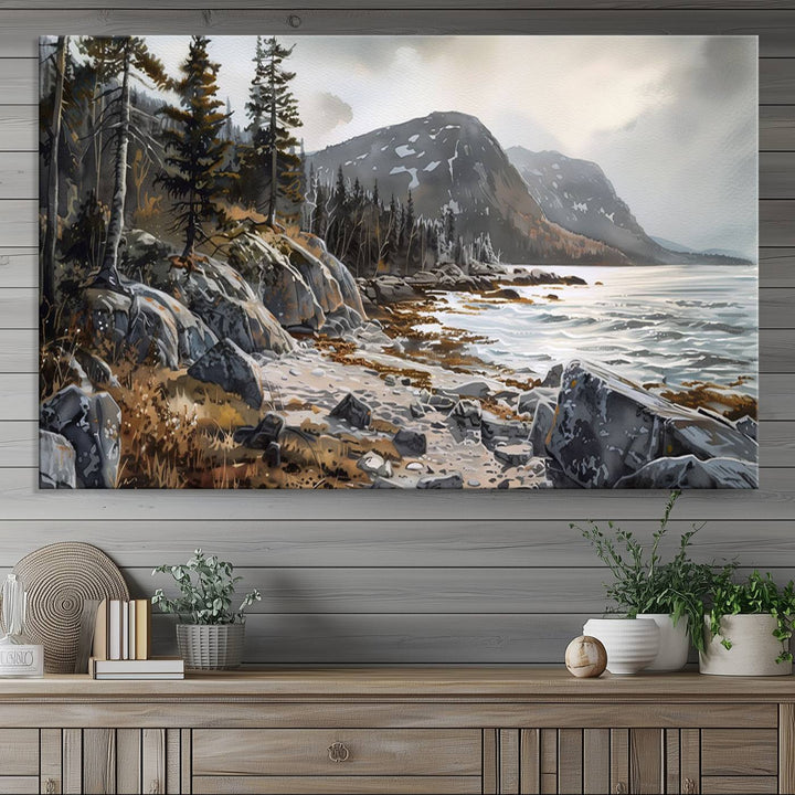 Framed wall art depicting Acadia National Parks rocky coast, trees, mountains, and sunlight over the sea; ready to hang.