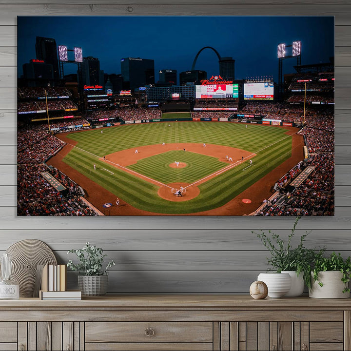 A St. Louis Cardinals Baseball Team print of Busch Stadium at night adorns the wall.