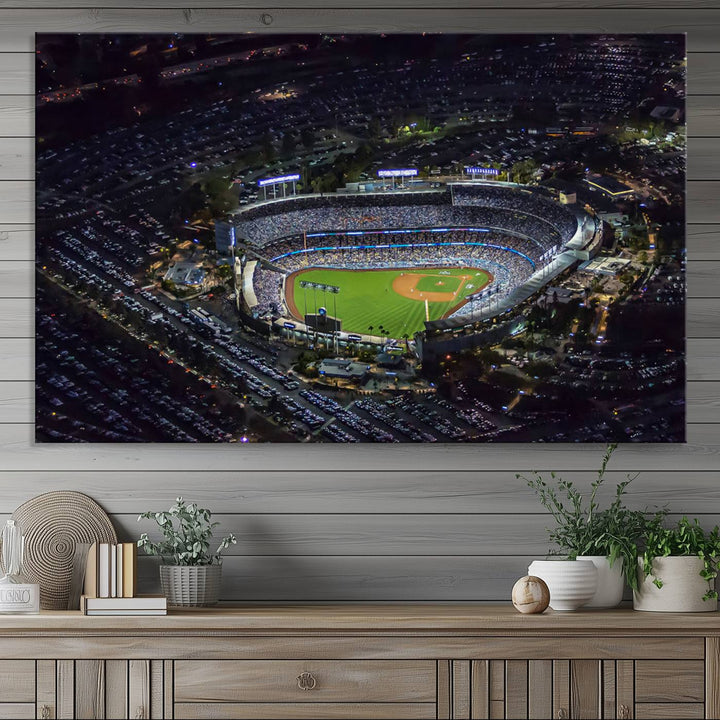 A large Los Angeles Dodgers print of Dodger Stadium at night is displayed near a window.