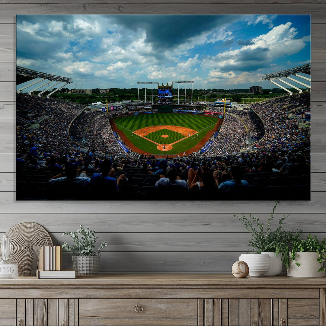 A 3-panel print of Kauffman Stadium, showcasing a crowded baseball field under cloudy skies.