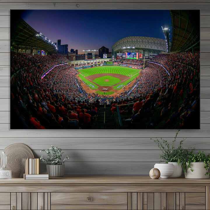 A canvas print of Houston Minute Maid Park at dusk is mounted on the wall.