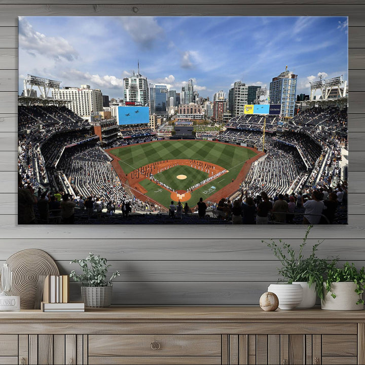 The San Diego Padres Baseball Canvas Print of Petco Park enhances the modern kitchen-dining area.