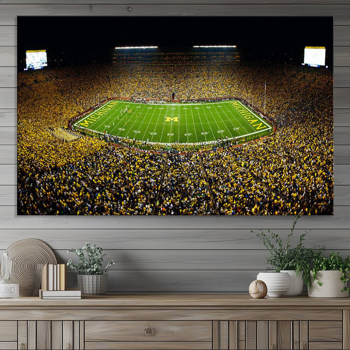 Aerial view of Michigan Stadium night game, ideal for Michigan Wolverines Football Team displayed on a triple canvas wall art.