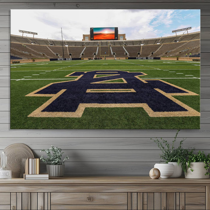 Notre Dame Stadium Triptych: This ready-to-hang giclee canvas print features a vibrant depiction of the football field adorned with an A logo and a stunning sunset.