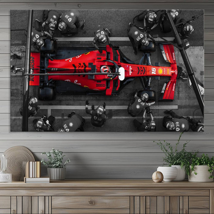 The Ferrari Pit Stop Canvas Wall Art features bold motorsport imagery that captures the precision and speed of Formula 1.