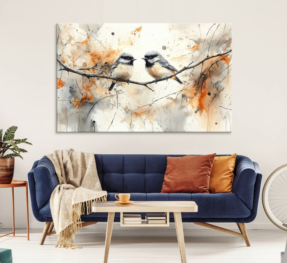 The living room features abstract watercolor chickadee bird art on the wall.