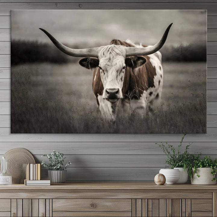 The Texas Longhorn Cow Canvas Wall Art Print adds a rustic touch to a living room.