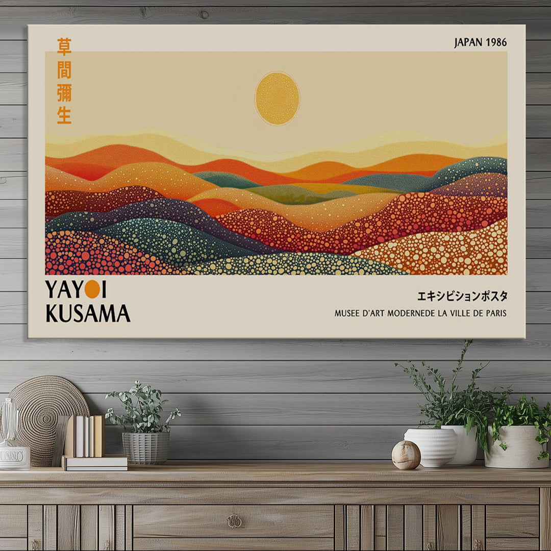 The Yayoi Kusama Wall Art Print is a vibrant abstract landscape canvas featuring colorful, dotted hills and a sun, reminiscent of Yayoi Kusama's iconic designs.