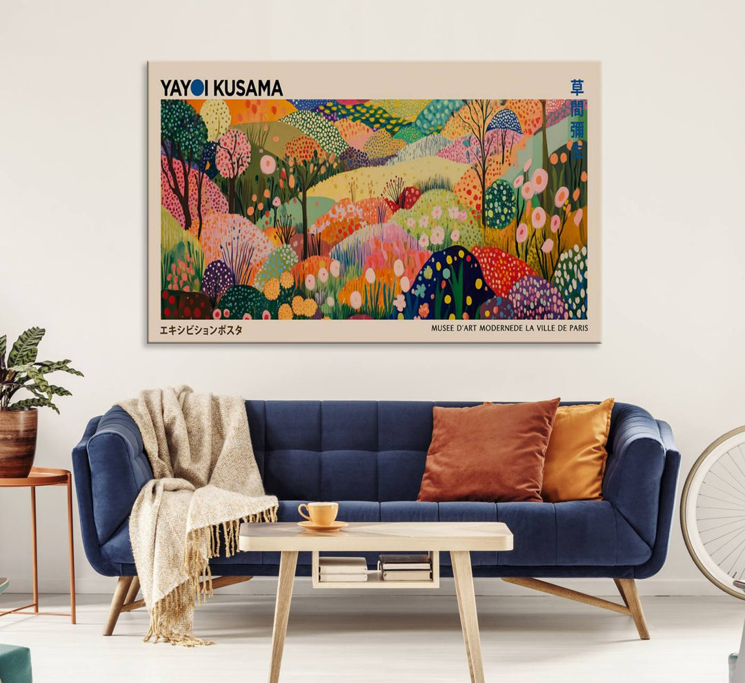 A Yayoi Kusama Wall Art Canvas Print featuring vibrant abstract floral patterns is displayed in a tranquil forest setting.