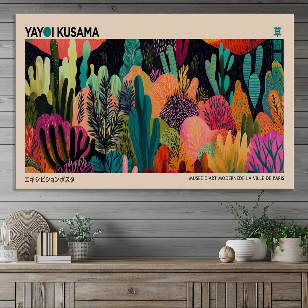 The vibrant canvas print of wall art features abstract plants, with the elegant text "Yayoi Kusama Wall Art Canvas Print" displayed on the colorful frame.