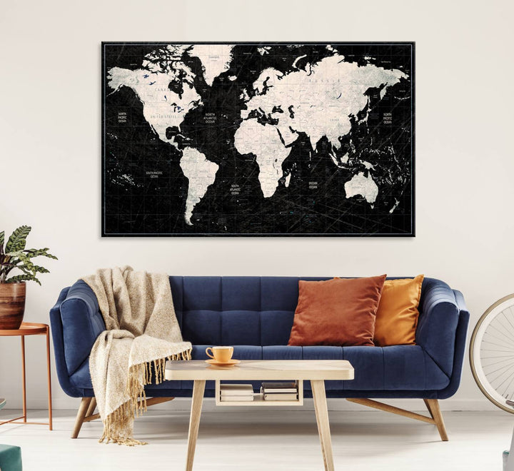 The Black & White World Map Canvas Wall Art, a giclee print, elegantly decorates the wall.