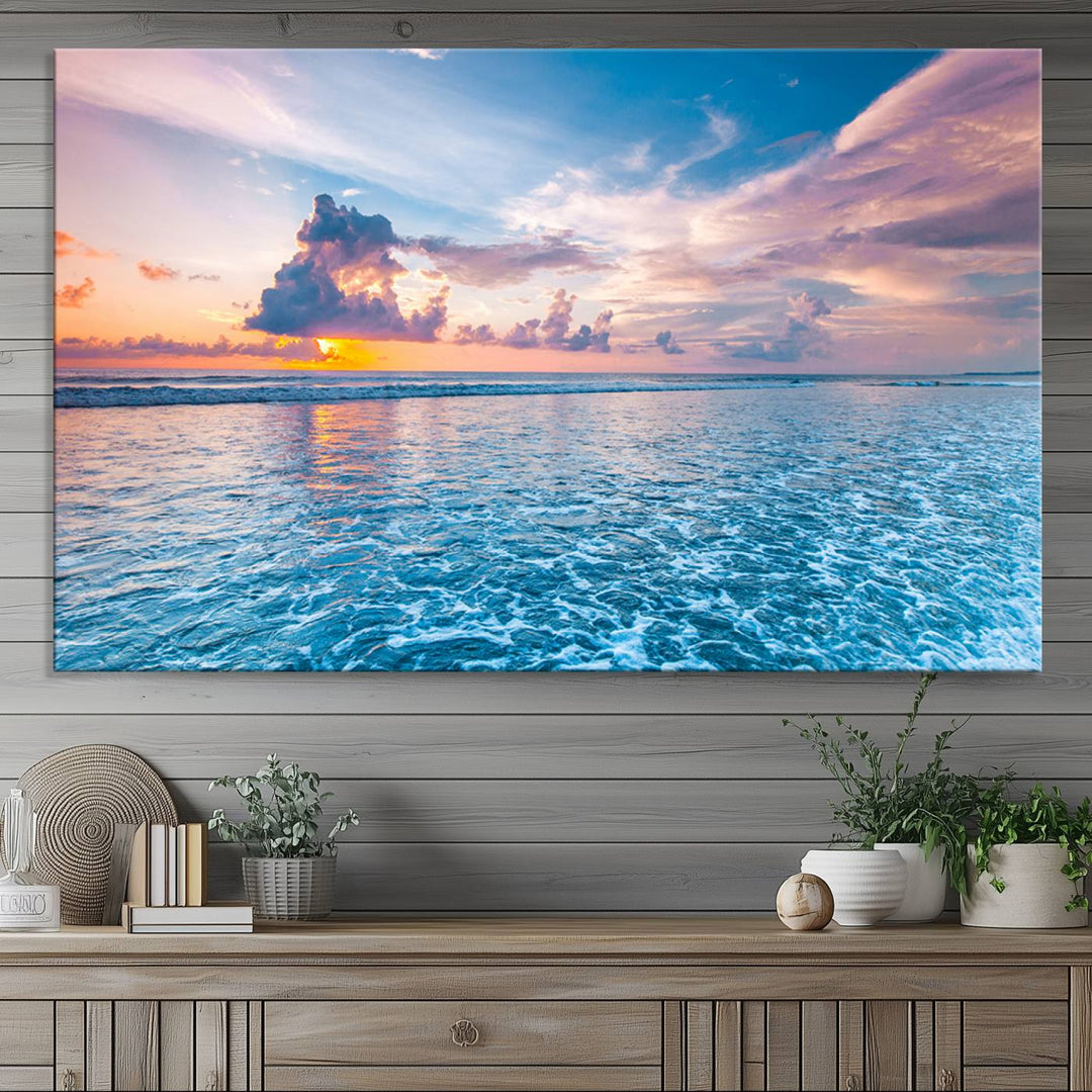 An Ocean Sunset Canvas Wall Art depicting a vibrant sky and rolling waves.