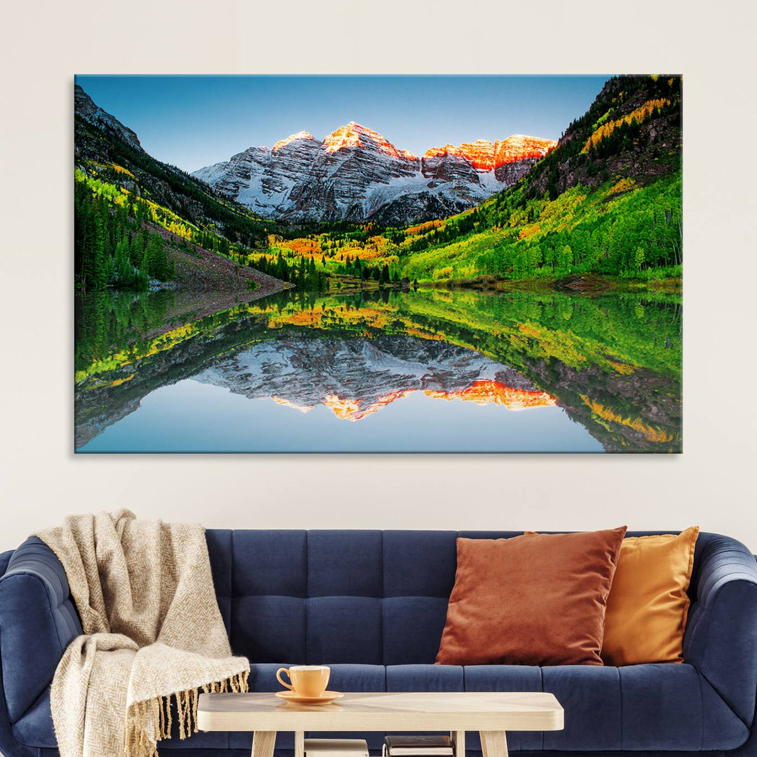 The Sunrise Maroon Bells Lake Wall Art Print beautifully captures North Maroon Peak mirrored in the tranquil lake, framed by lush greenery.