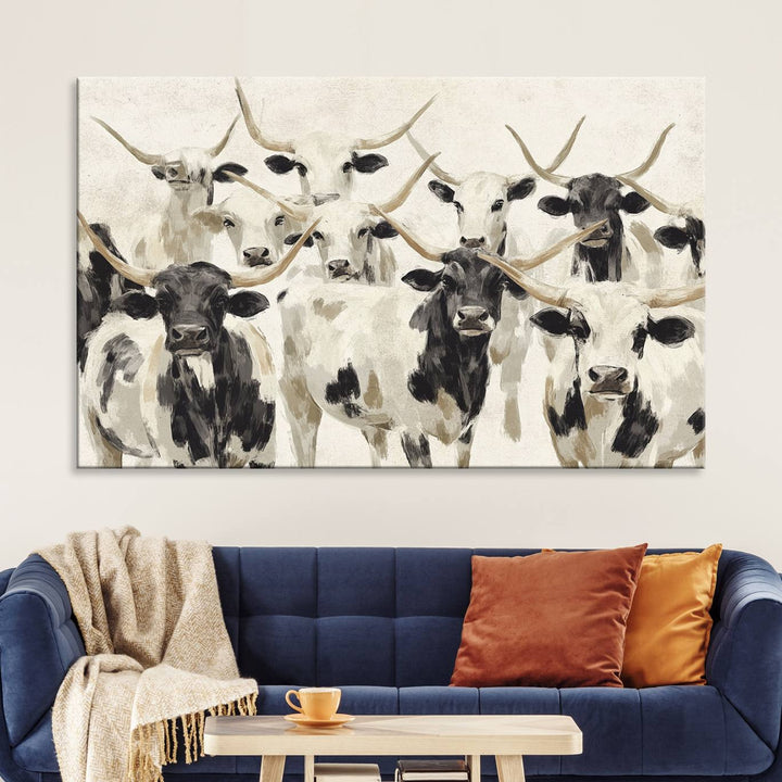 Canvas print titled Longhorn Texas Cow Drawing, depicting longhorn cattle with black and white markings, made in the USA, displayed on the wall.