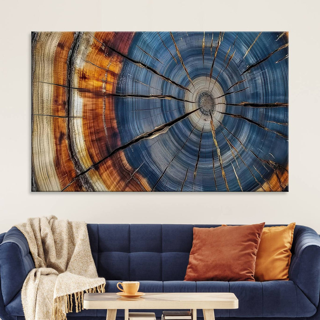 Close-up of blue, brown, and orange wood grain rings on the Abstract Tree Rings Canvas Wall Art Print.