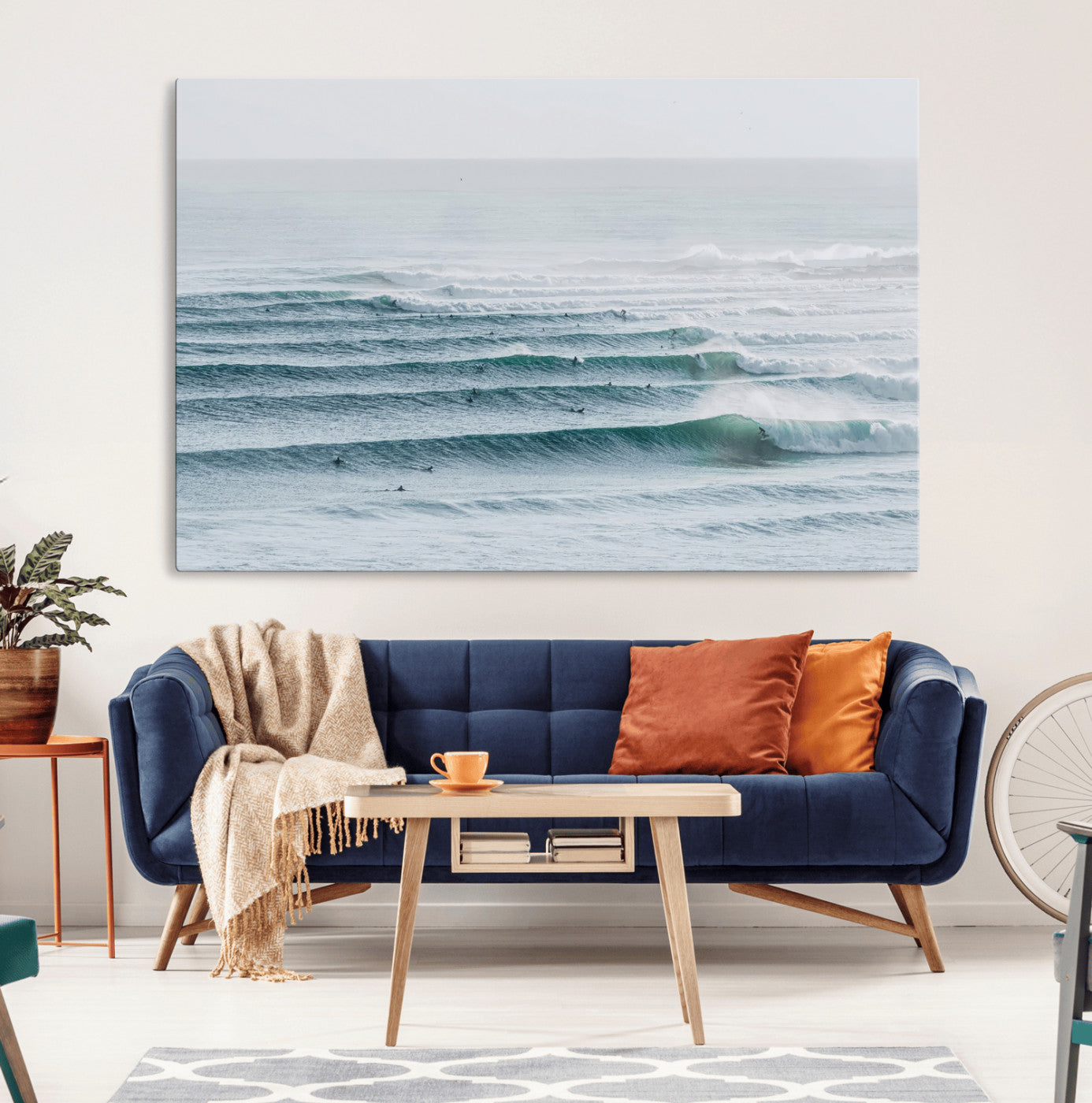 High-angle view of surfers lining up across layered ocean waves, ideal for minimal coastal or surf-inspired room decor.