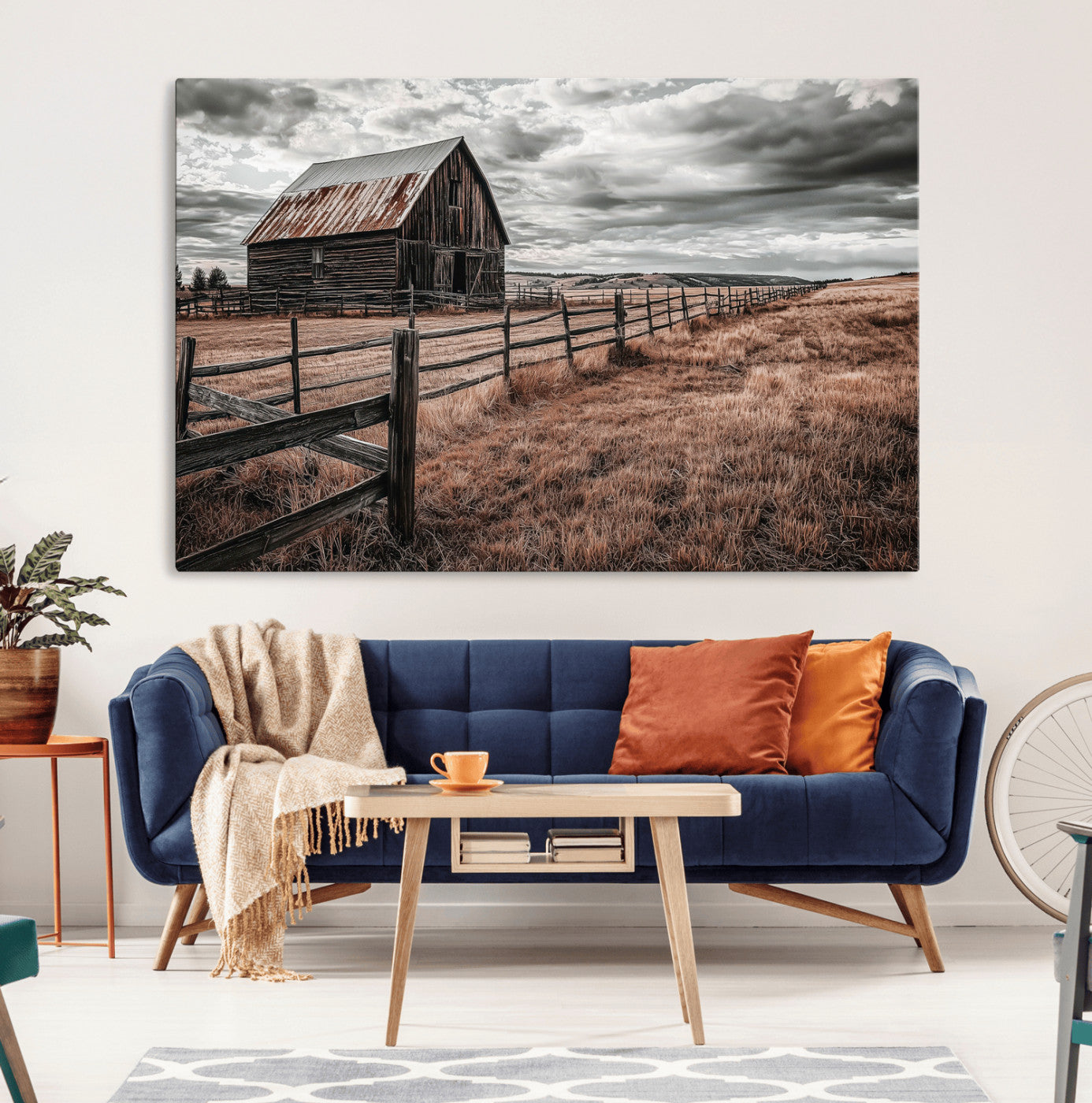 Framed canvas of a rustic barn under a moody sky with weathered fence and dark fields, ideal for farmhouse or rural-style wall decor.