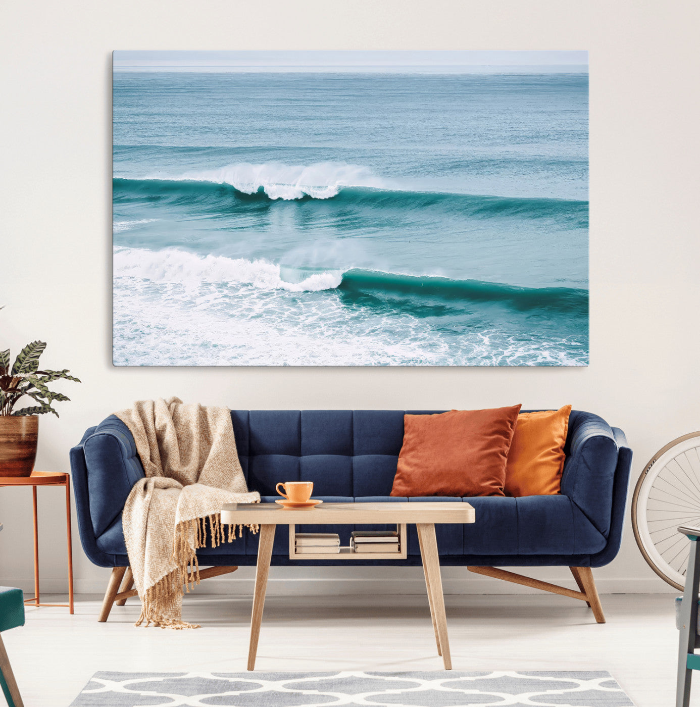 Powerful ocean waves rolling towards the shore, their turquoise hues blending with white sea foam under an open horizon, capturing the essence of the ocean's movement.