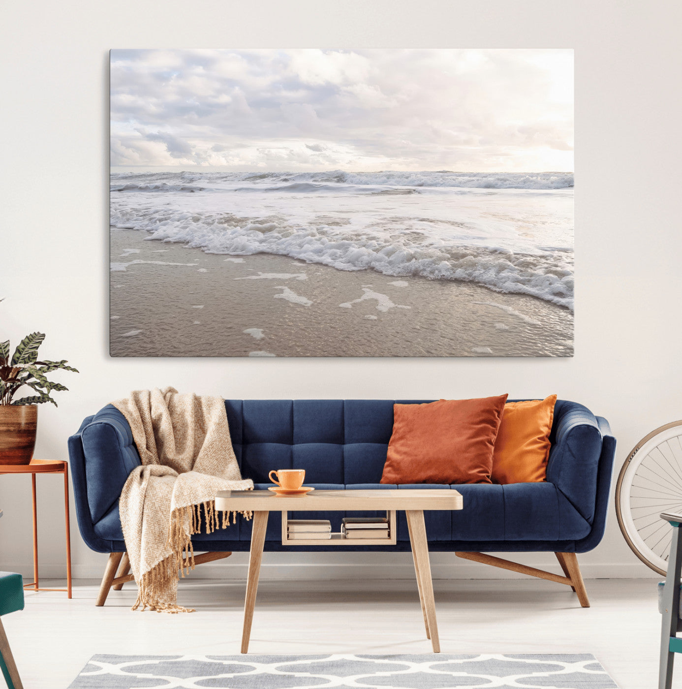 Peaceful ocean waves rolling onto the sandy shore under soft light, perfect for neutral or coastal minimalist decor themes.