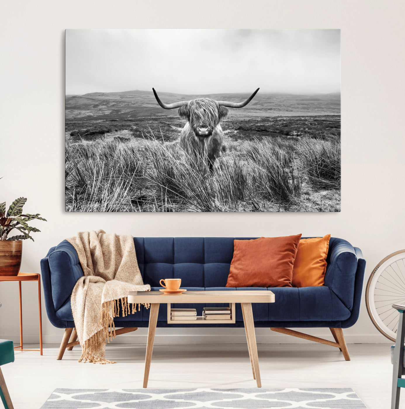 A black and white portrait of a Highland cow in a foggy Scottish countryside, capturing a rustic aesthetic and tranquil farm escape.