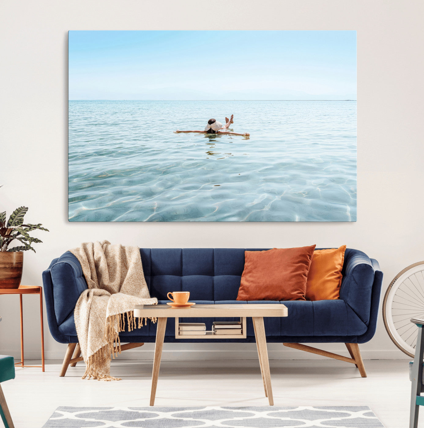 A peaceful minimalist scene of a person floating on crystal-clear water, surrounded by a vast open horizon, capturing relaxation and serenity in a tranquil aquatic setting.