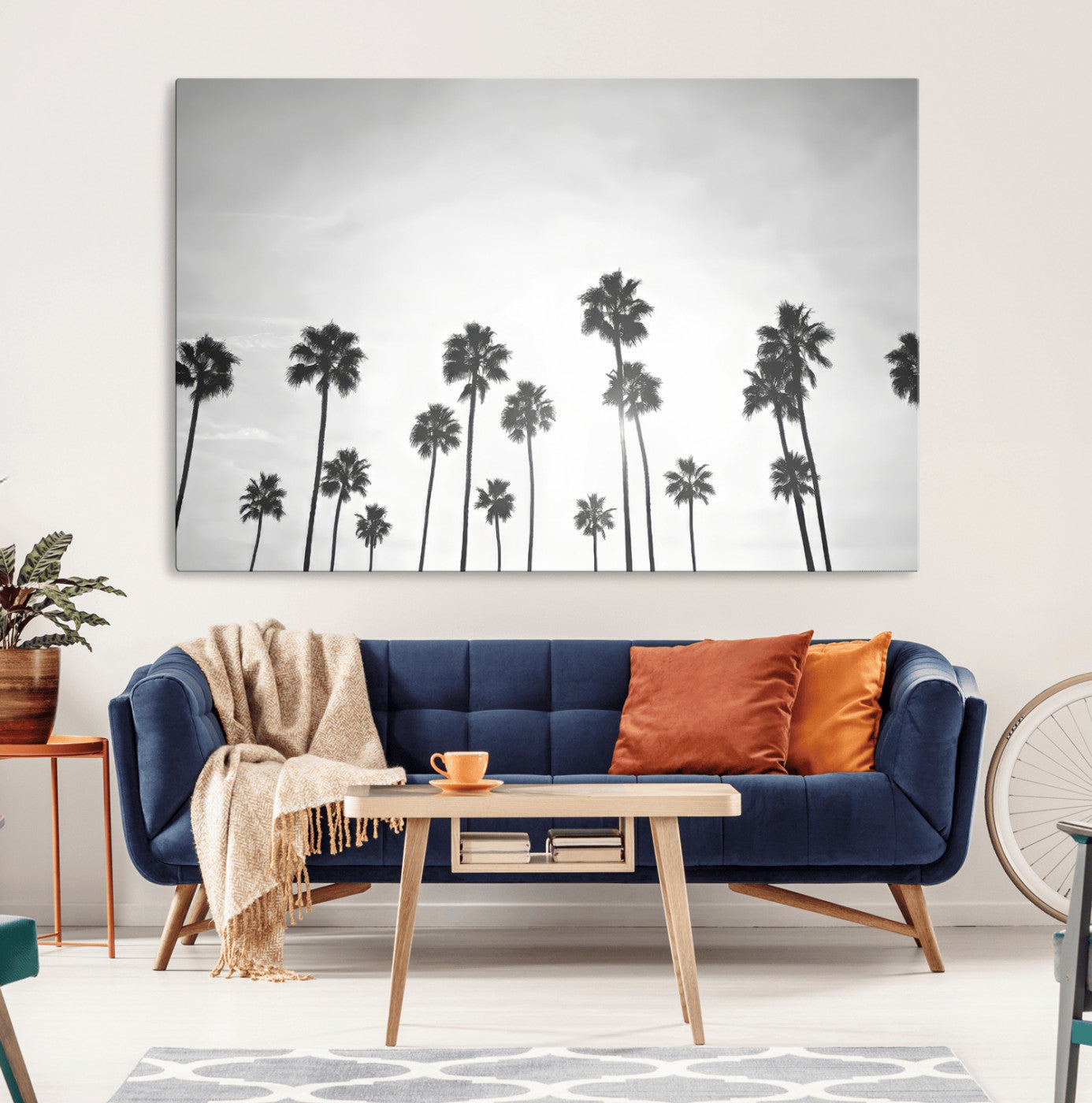 A black and white minimalist scene featuring tall palm trees silhouetted against a bright sky, creating a dreamy and timeless tropical aesthetic.