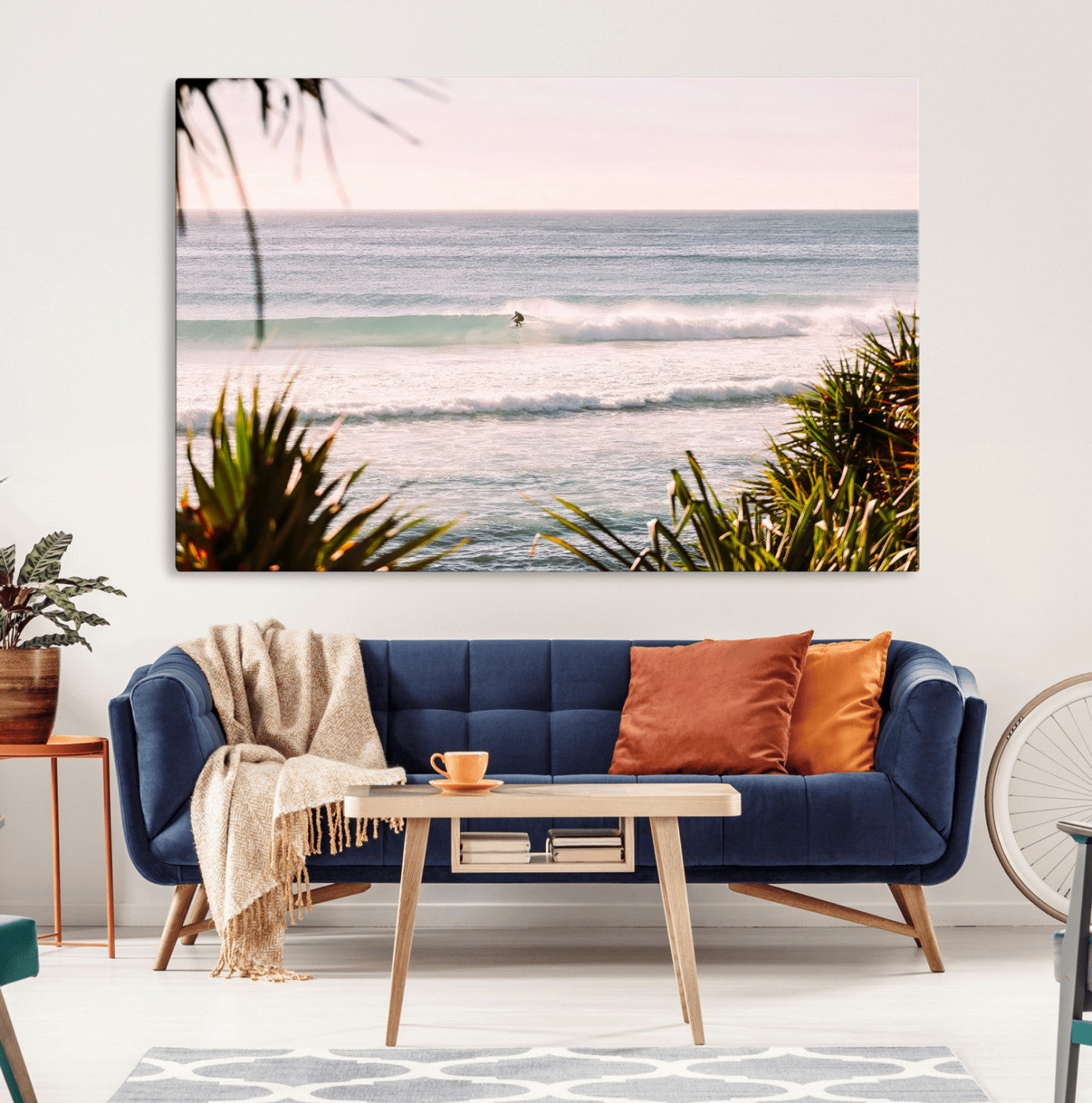 Canvas of a lone surfer riding a pastel wave at sunrise, perfect for tropical or coastal-themed spaces with a relaxed, airy vibe.