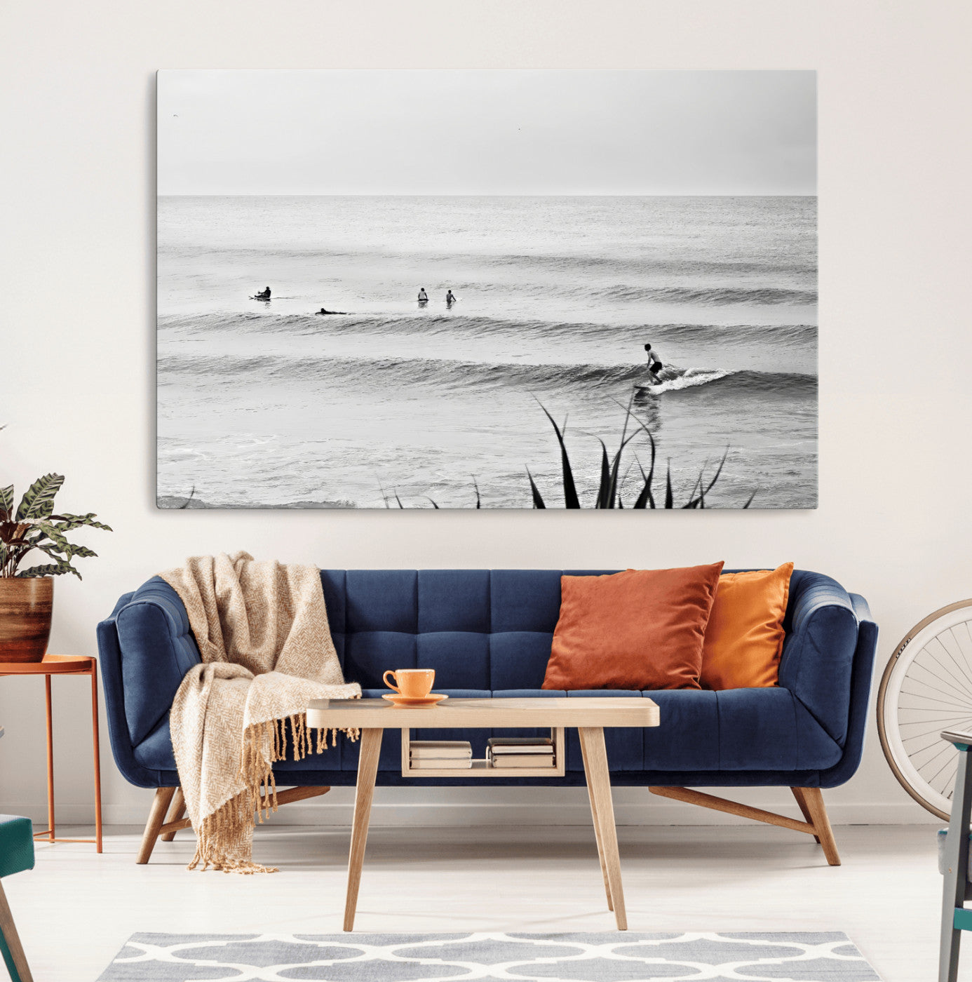 Monochrome canvas of surfers on calm ocean waves, ideal for minimalist coastal or beach-inspired interior decor.
