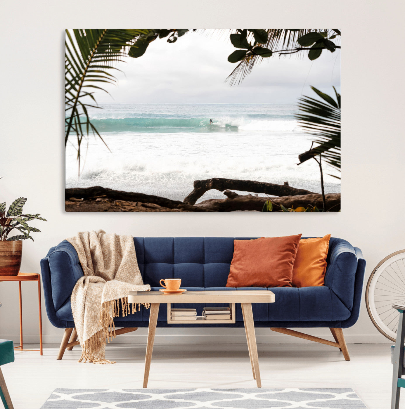 Tropical beach view with palm trees and surfer riding a wave, perfect for boho or coastal-inspired interior wall decor.