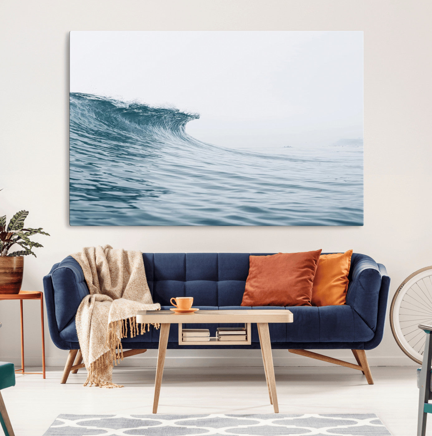 A single ocean wave curling in soft blue tones under a misty sky, ideal for coastal or minimalist home wall decor.