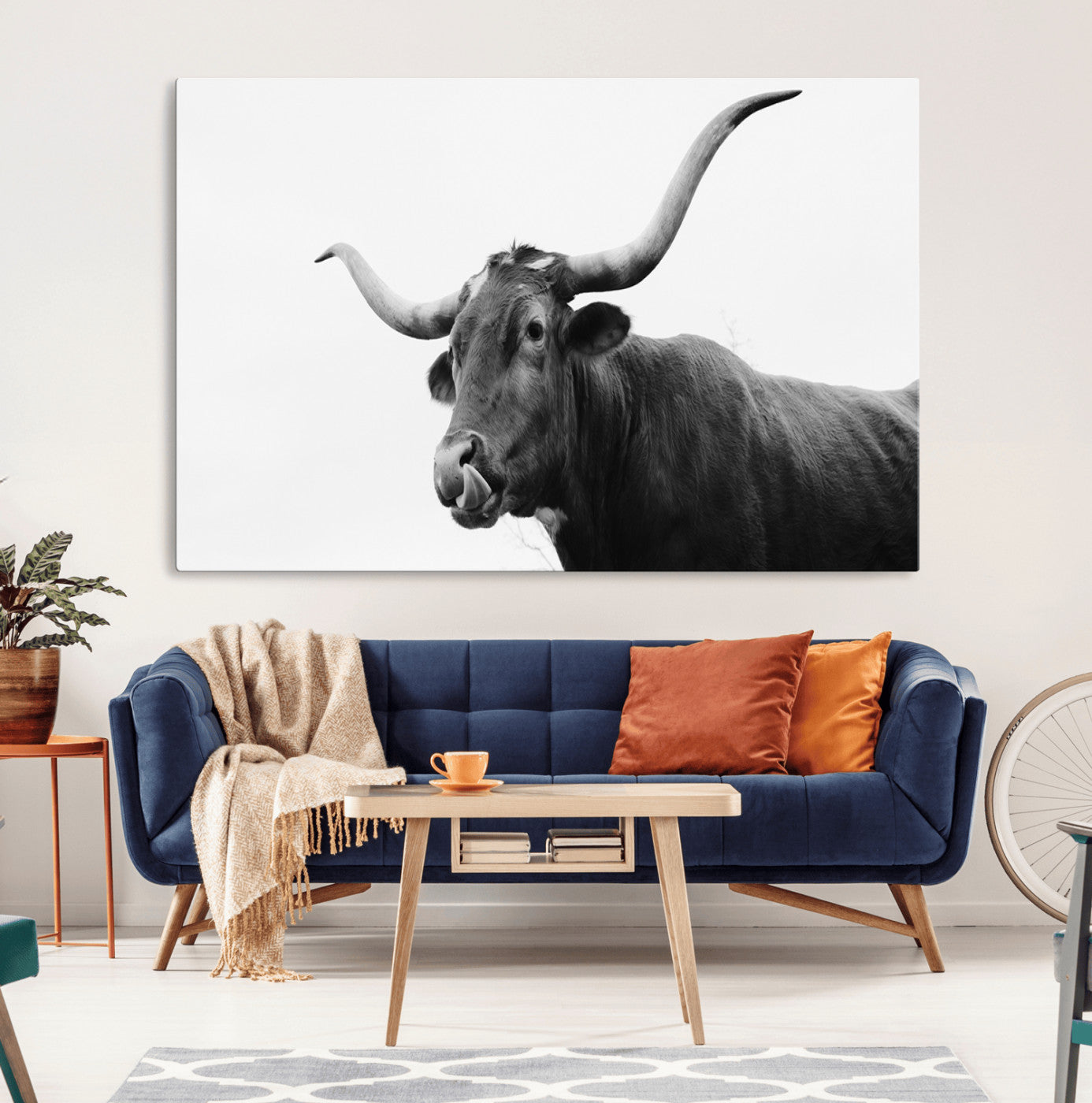 Black and white photo of a Texas Longhorn cow with curved horns, ideal for rustic, western or minimalist style home decor.