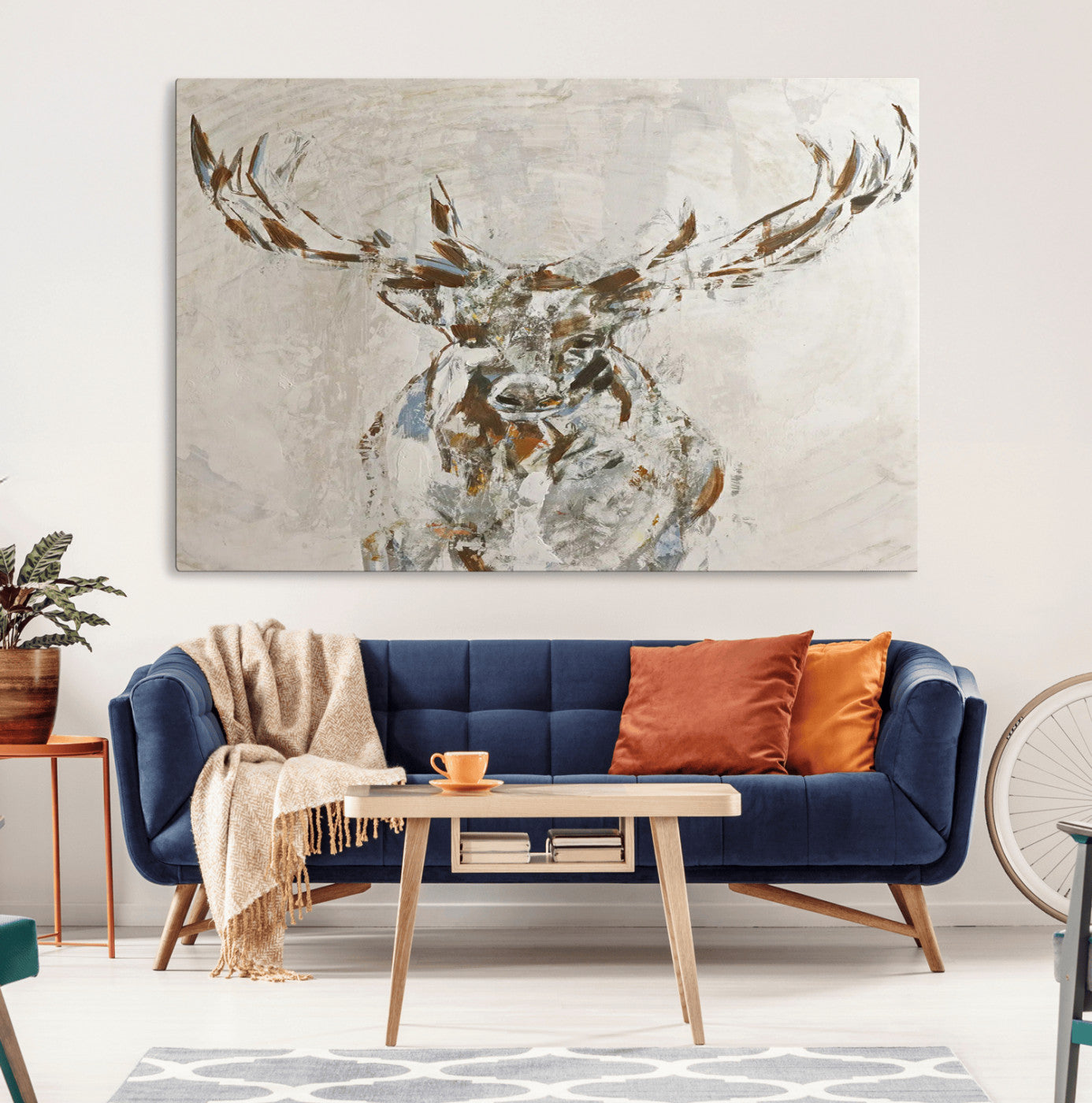 Abstract painting of a deer with antlers in neutral earth tones, ideal for modern rustic or lodge-style living room wall decor.