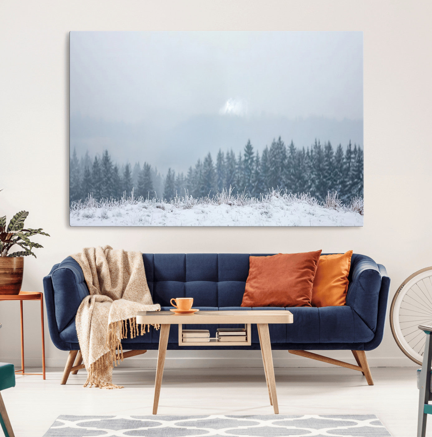 Snow-covered forest under misty sky, soft light breaking through clouds, ideal for minimalist or Nordic-inspired home decor.