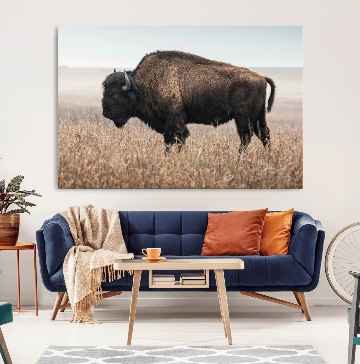 A lone bison stands in a vast prairie under a soft sky, evoking freedom and rustic charm for western or farmhouse inspired interiors.