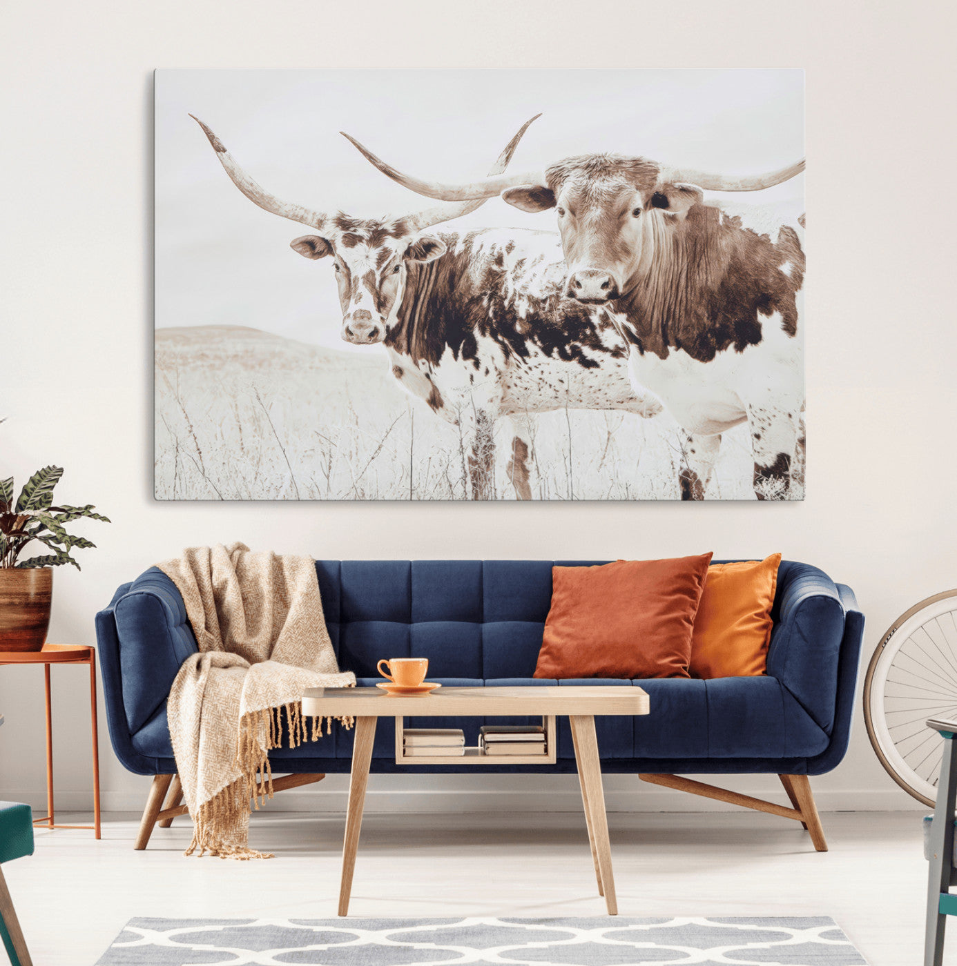 Two longhorn cows standing in a sepia-toned pasture with soft light, ideal for rustic or farmhouse-themed neutral wall decor.
