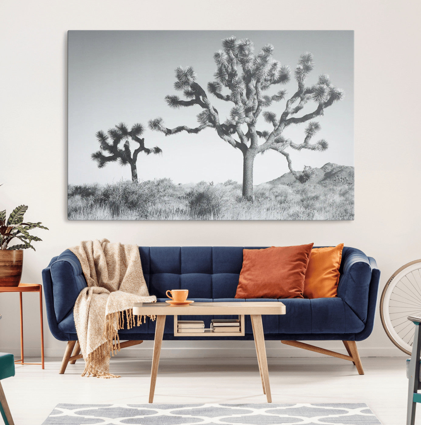 Black and white Joshua tree in a desert landscape with soft light and dry brush, perfect for rustic or minimalist home decor.