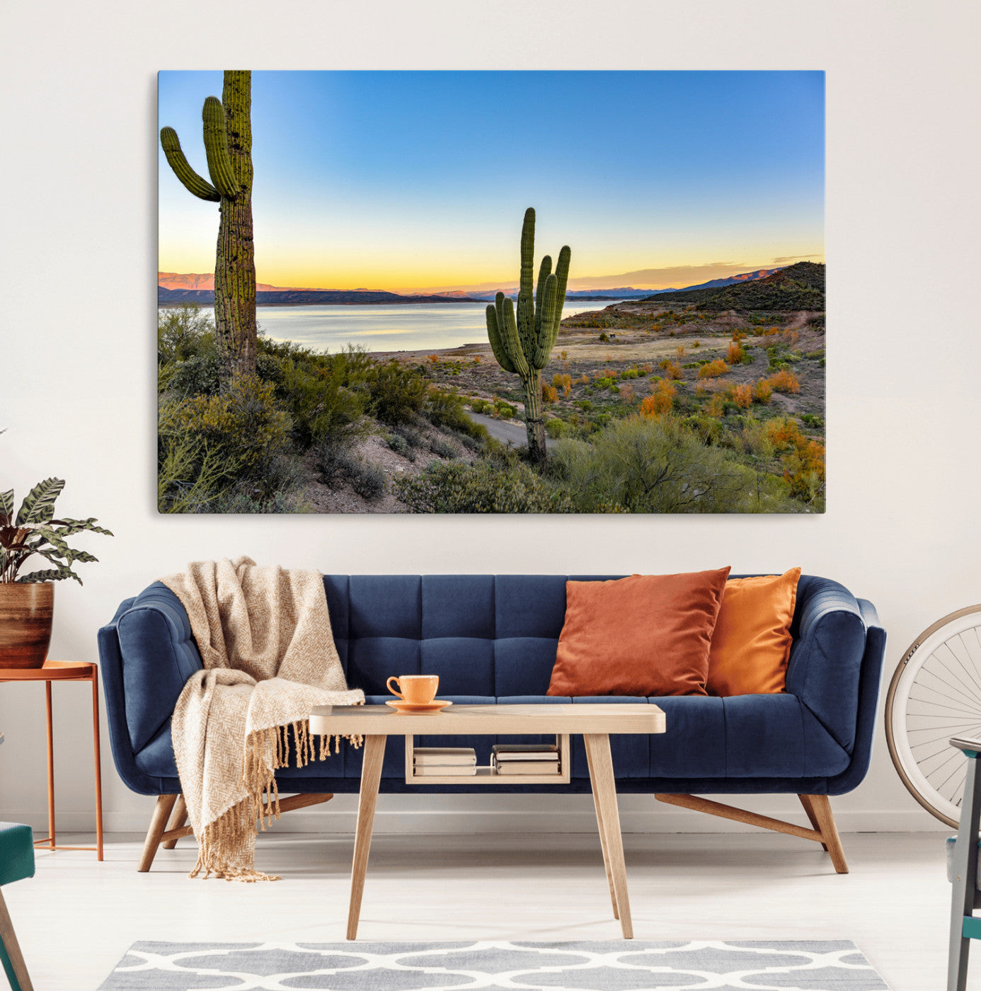 Desert landscape with saguaro cacti and lake at sunset, featuring vibrant sky and hills, ideal for Southwestern or rustic wall decor.