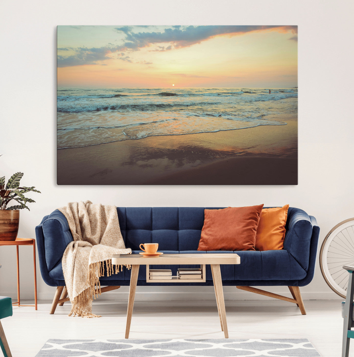 Warm sunset over gentle ocean waves with pastel sky and reflections on wet sand, creating a calm and soothing beach ambiance.