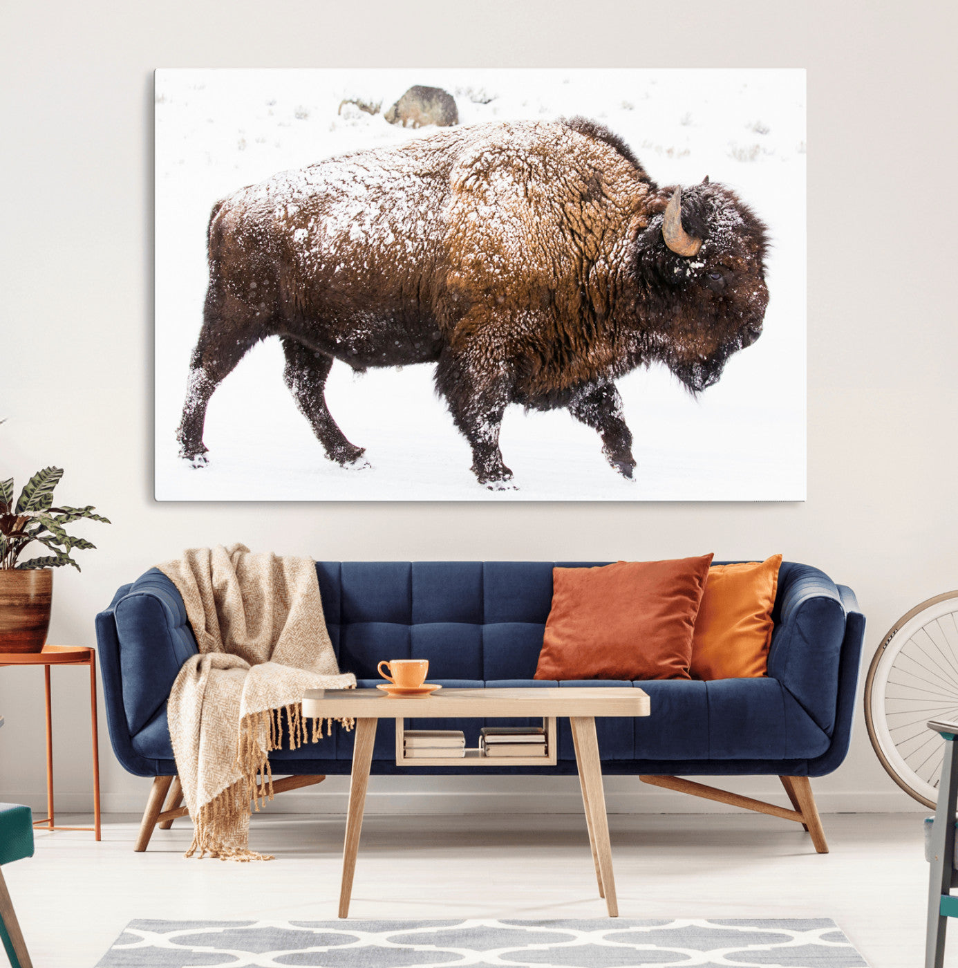 Side profile of a powerful bison walking through deep snow, with frost-covered fur and a white winter background, perfect for rustic and western decor.