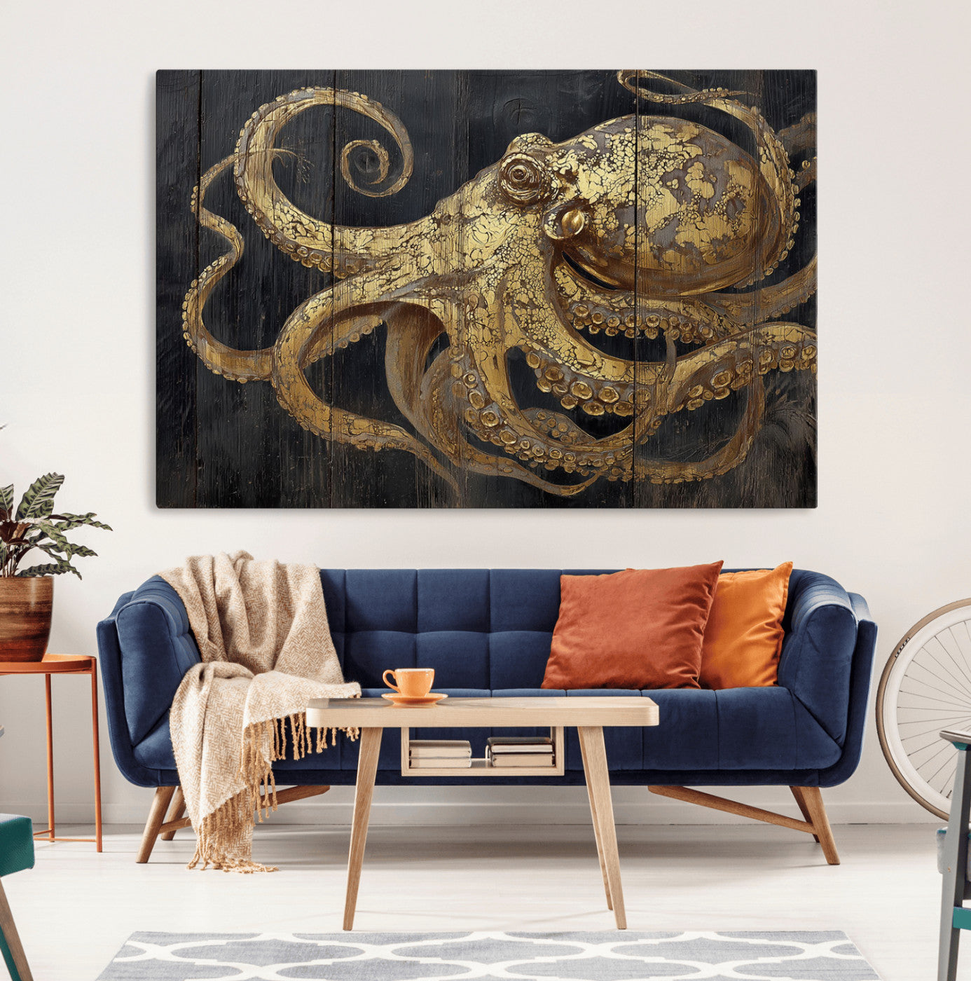 A detailed gold illustration of an octopus on black wooden planks, showing its intricate tentacles and textured skin in an artistic style.