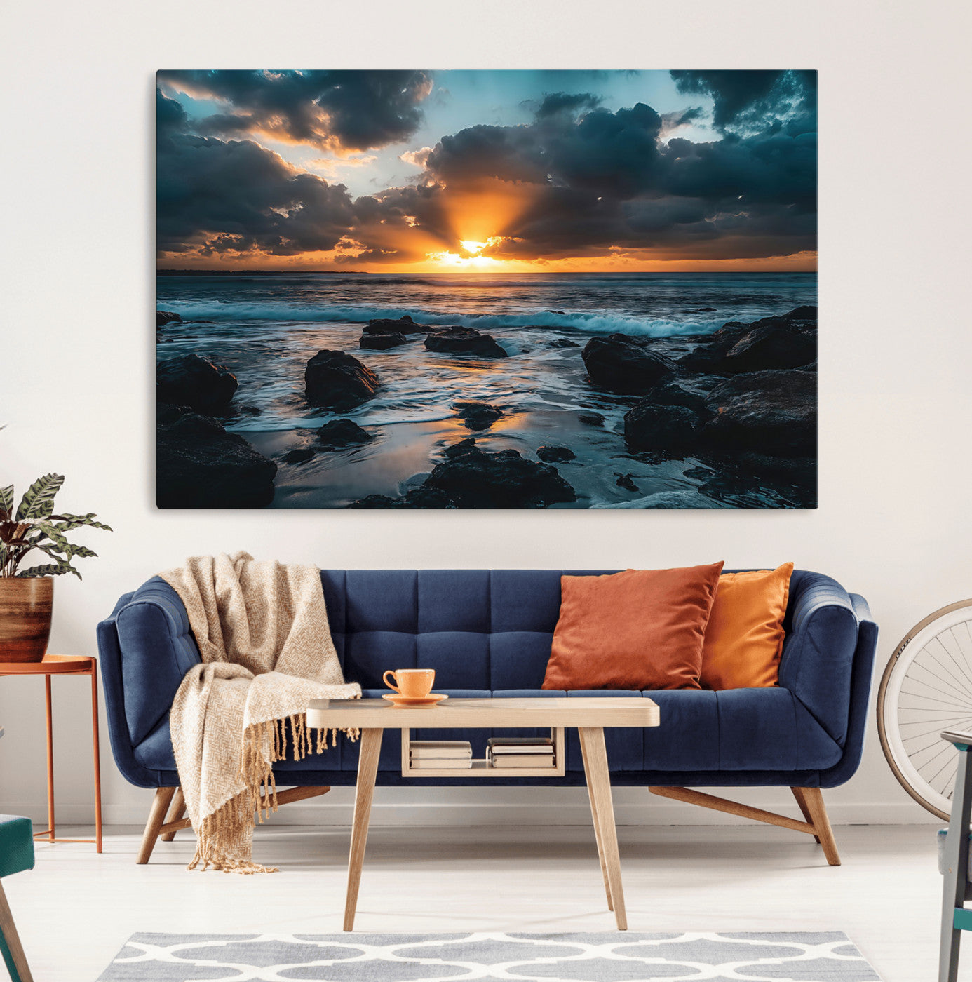 An awe-inspiring sunset over the ocean with rays of light piercing through dramatic clouds, creating a beautiful seascape with rocks in the foreground.