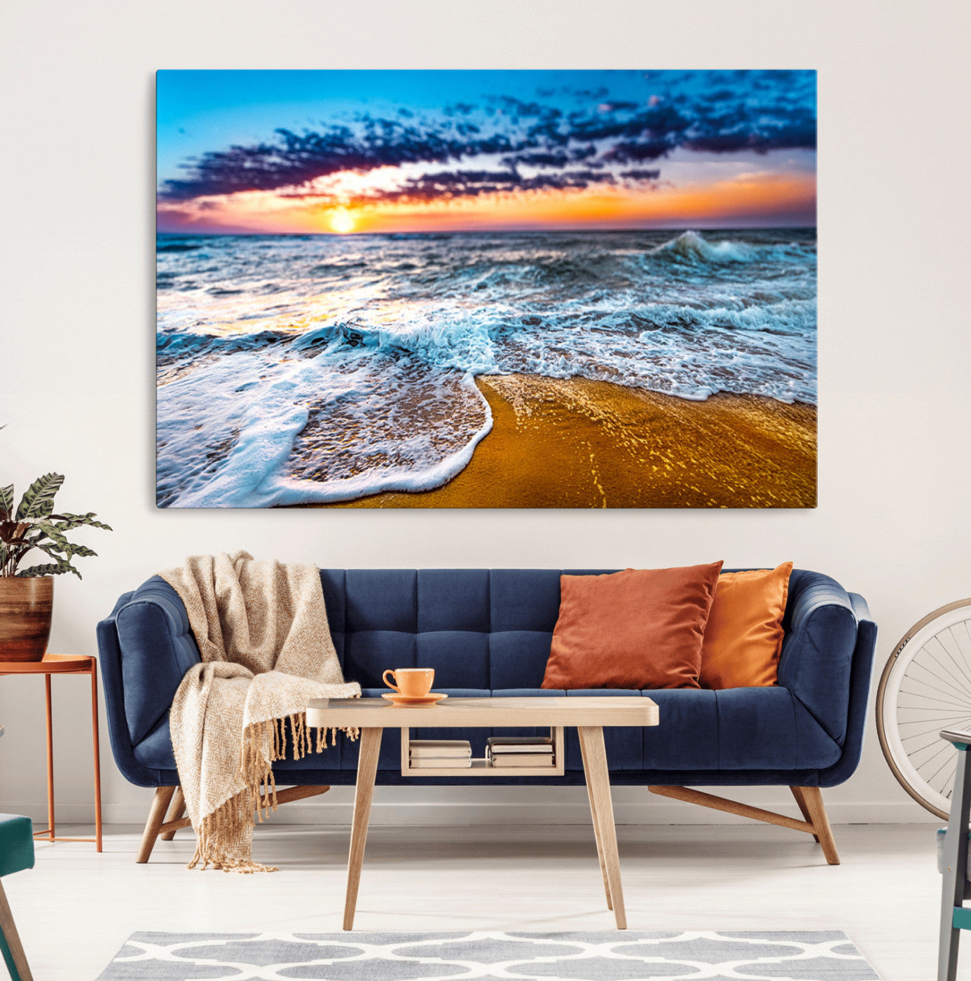 Beautiful ocean shoreline at sunset with foamy waves washing onto golden sand under a colorful sky – Wall Art Canvas Print.