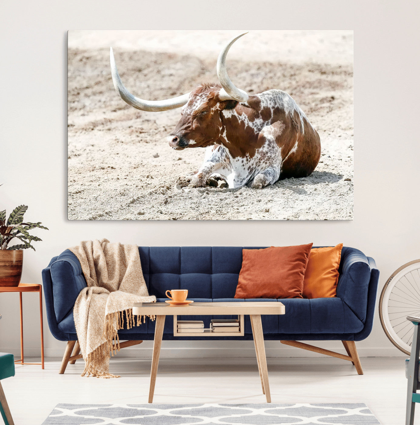 MGV-CV-36X24 - Majestic Longhorn Resting on Sunlit Desert Ground – Striking Western-Themed Wall Art Canvas Print