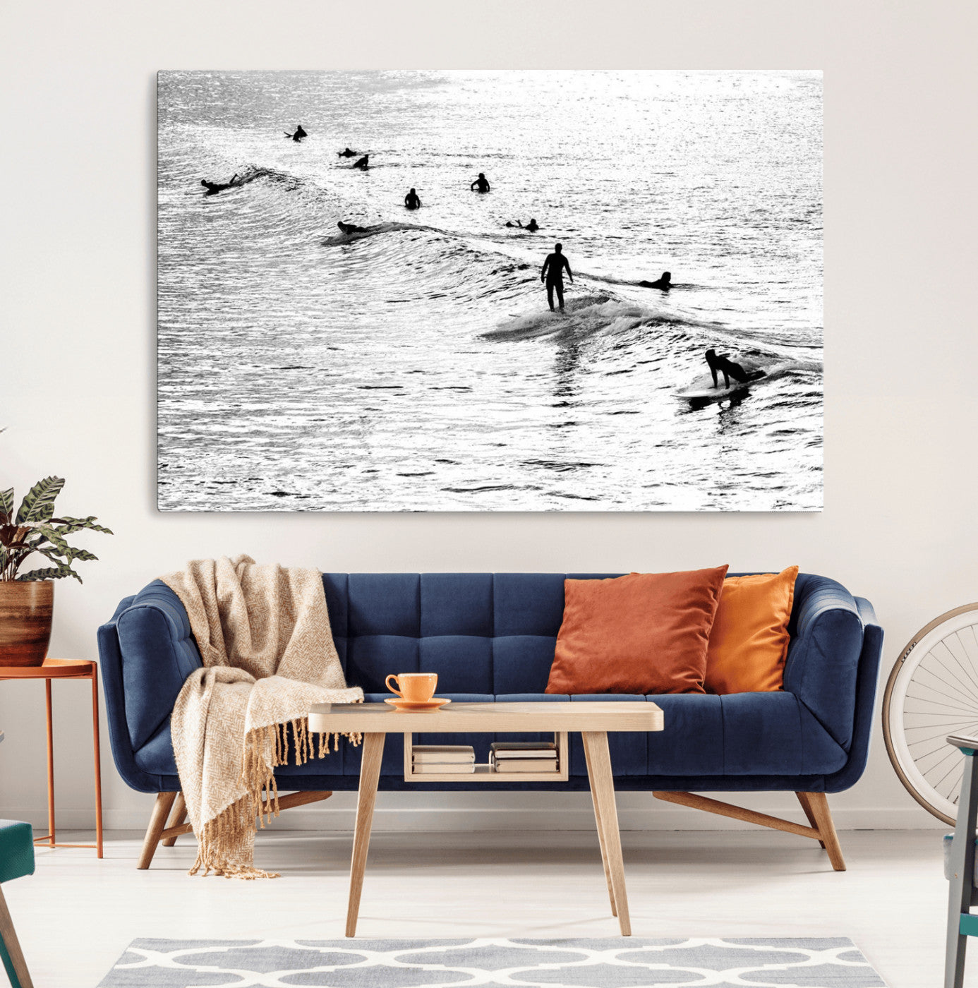 19970637-MGV-CV-36X24-Black and white artistic view of surfers riding and paddling on waves in the ocean, capturing the dynamic motion and energy of surfing