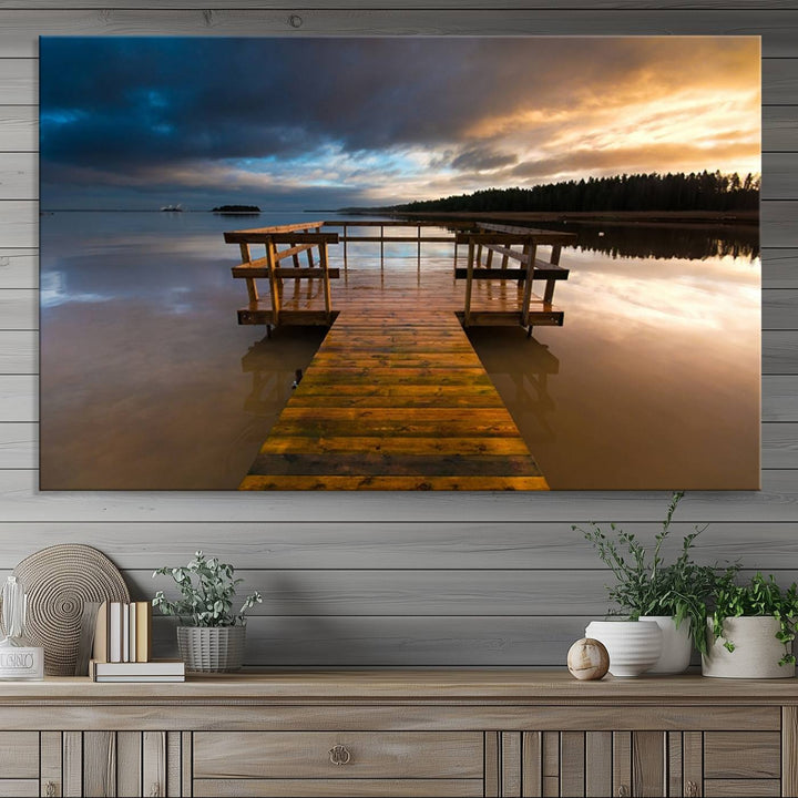 The "Serene Lake Pier at Sunset" landscape canvas print, crafted as ready-to-hang and framed wall art, enriches the contemporary setting by capturing the tranquility of a lakeside pier at sunset.