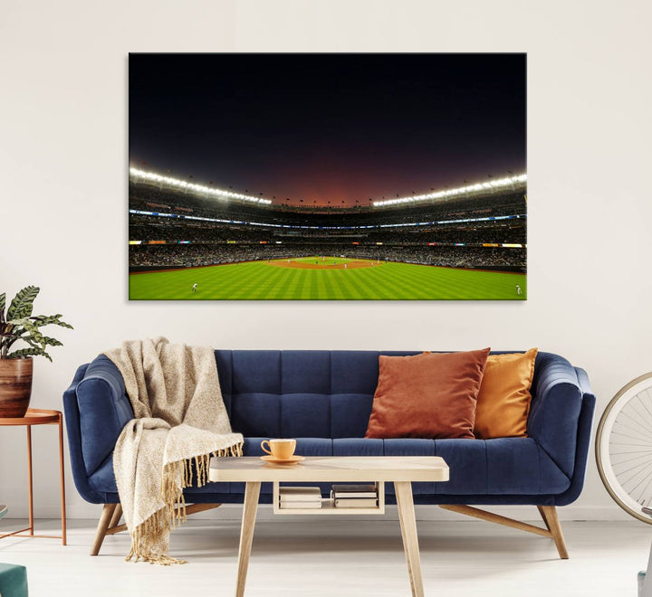 A night game at Yankee Stadium depicted on canvas beneath a sunset sky.