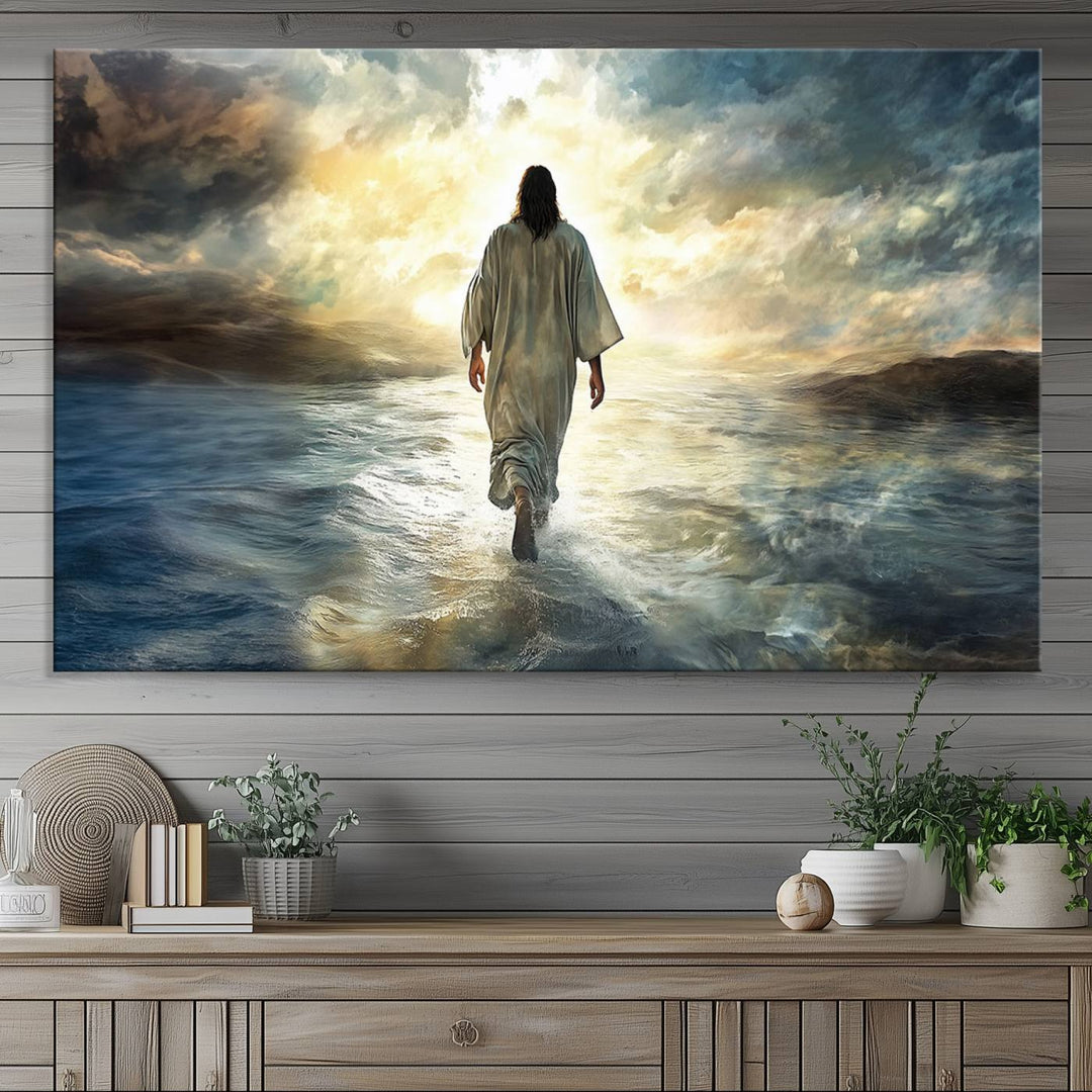 The Jesus Walking on Water Wall Art, a captivating triptych canvas print, showcases a person walking on water beneath dramatic clouds. This ready-to-hang piece seamlessly combines faith and style for your Christian home decor.